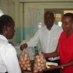 julius-and-hope-gives-food-to-a-doctor-at-mulango-for-sick-kids1-150x150